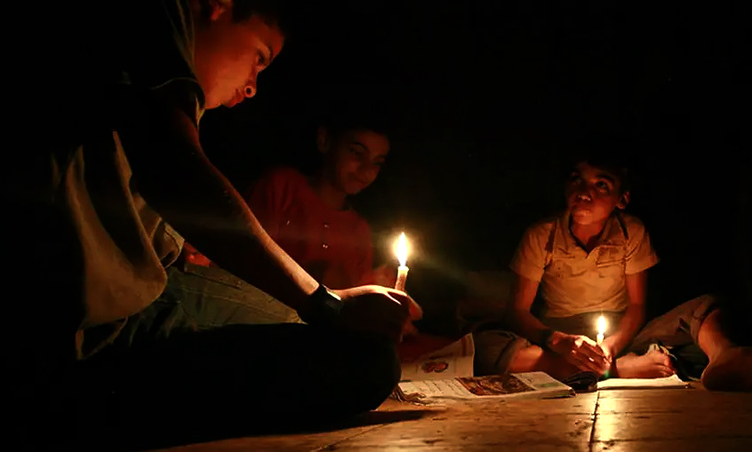 Students of Char Asariadaha union in Rajshahi's Godagari upazila were seen struggling to continue their study with candles. Photo: Farhana Anjum