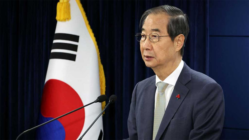 Acting South Korean President and Prime Minister Han Duck-soo delivers an address to the nation at the government complex in Seoul, South Korea, December 14, 2024. Yonhap via REUTERS