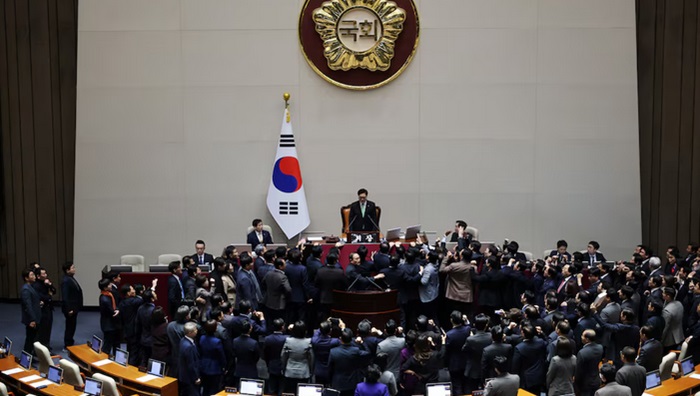 South Korea's ruling People Power Party lawmakers protest against National Assembly Speaker Woo Won-shik during the impeachment vote of a plenary session for South Korean acting President and Prime Minister Han Duck-soo at the National Assembly in Seoul, South Korea, December 27, 2024. PHOTO: REUTERS