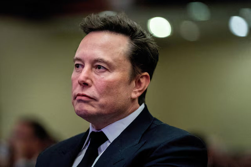 Tesla CEO and X owner Elon Musk listens as US President-elect Donald Trump speaks during a meeting with House Republicans at the Hyatt Regency hotel in Washington, DC, US on November 13, 2024. ALLISON ROBBERT/Pool via REUTERS 