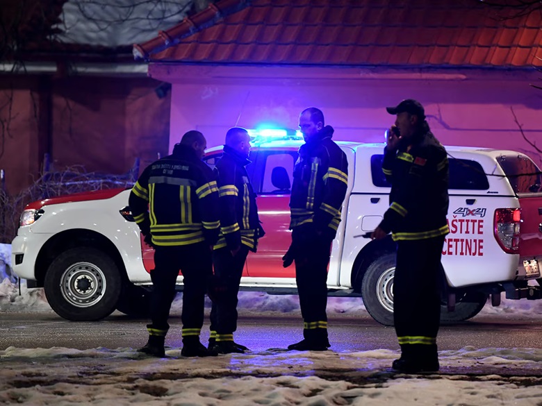 Police officers and civil protection units secure a crime scene after a gunman killed 10 people in the village of Bajice near Cetinje, Montenegro, on January 1, 2025. PHOTO: AFP